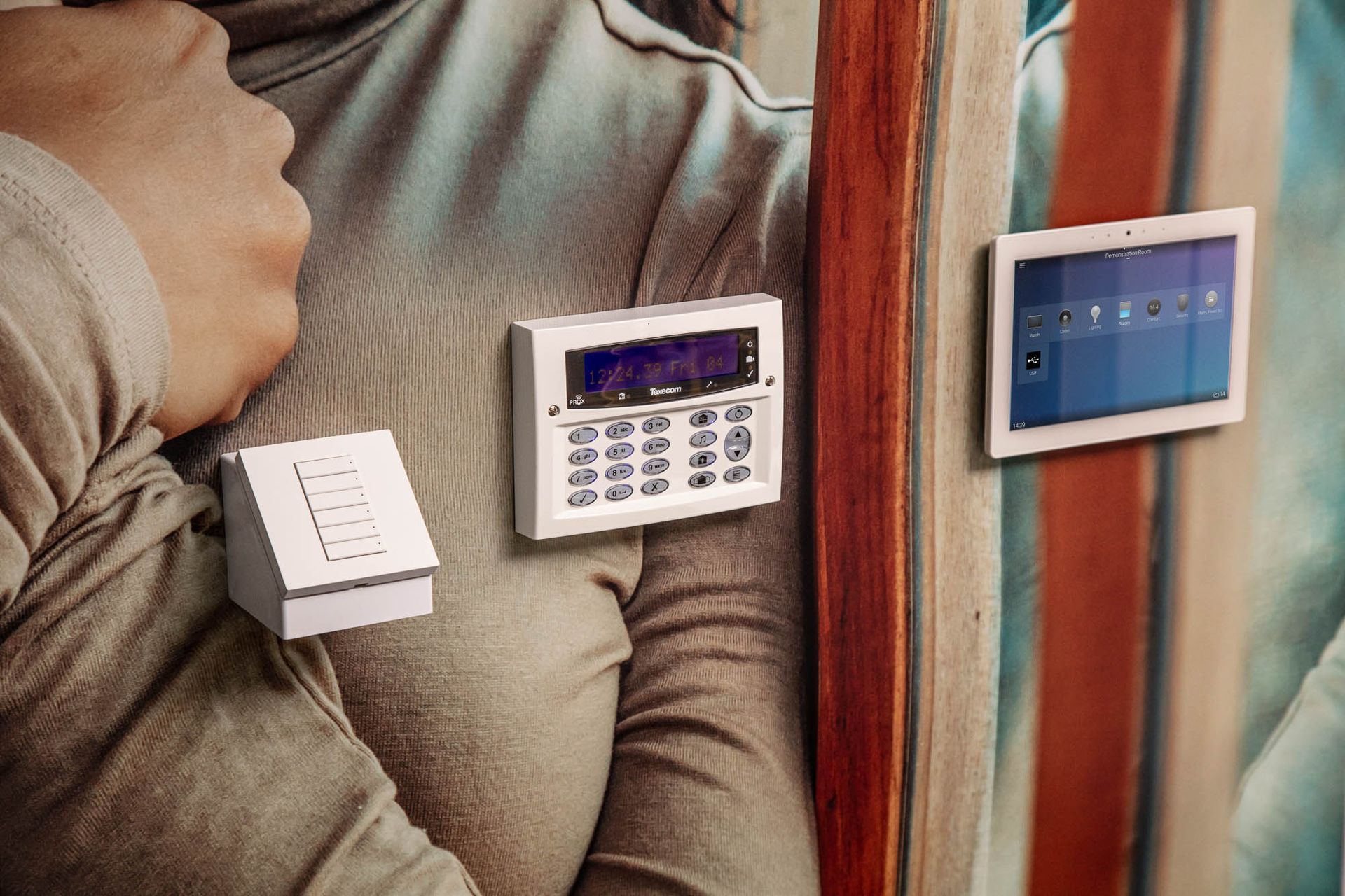 Control4 Wireless Light Switch, Texecom Intruder Alarm Keypad and Control4 8” In-Wall Touch Screen