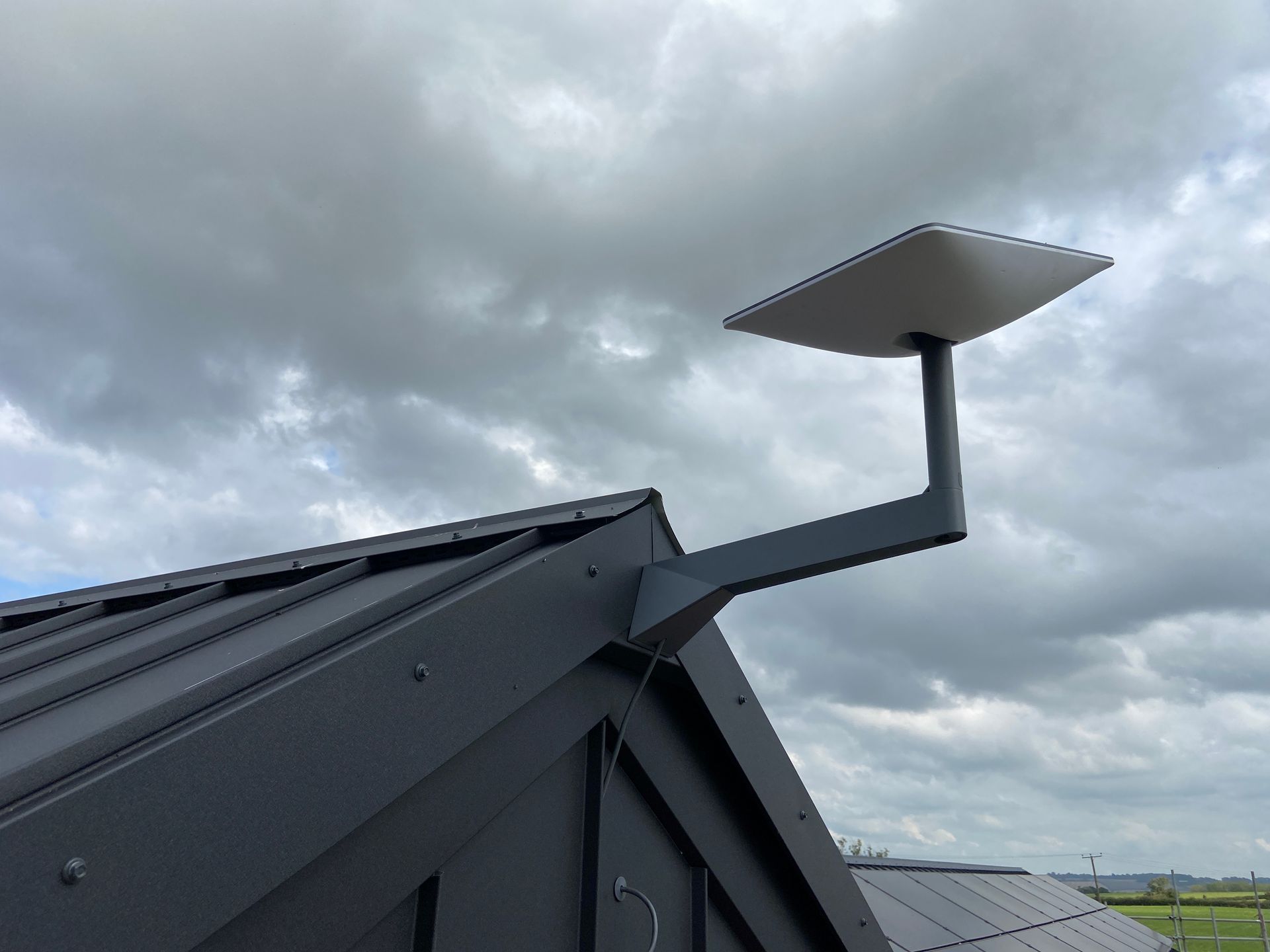 Starlink antenna attached to building