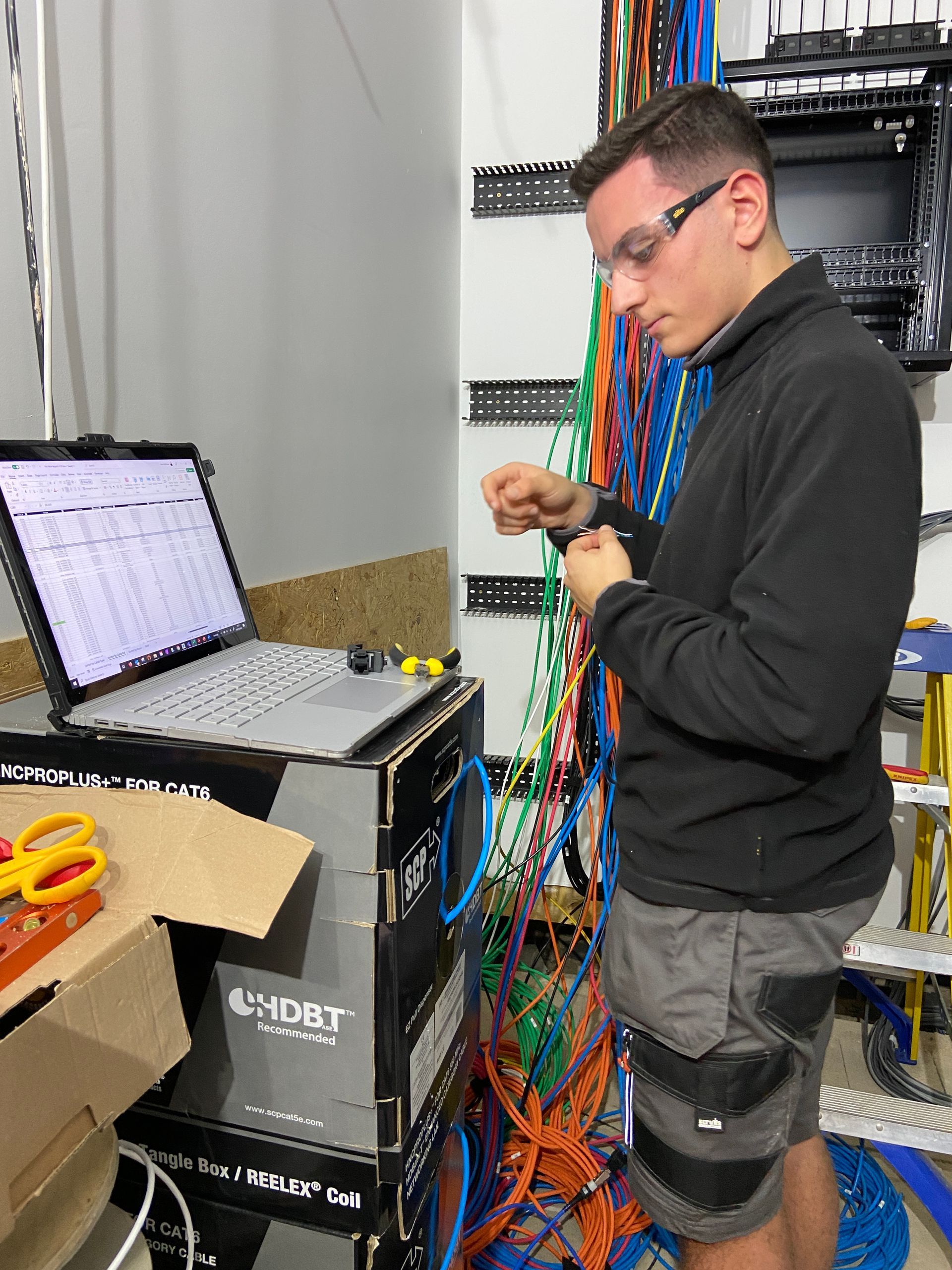 Photo of Termination of prewire CAT6A data cable into keystone jack prior to inserting into patch panel