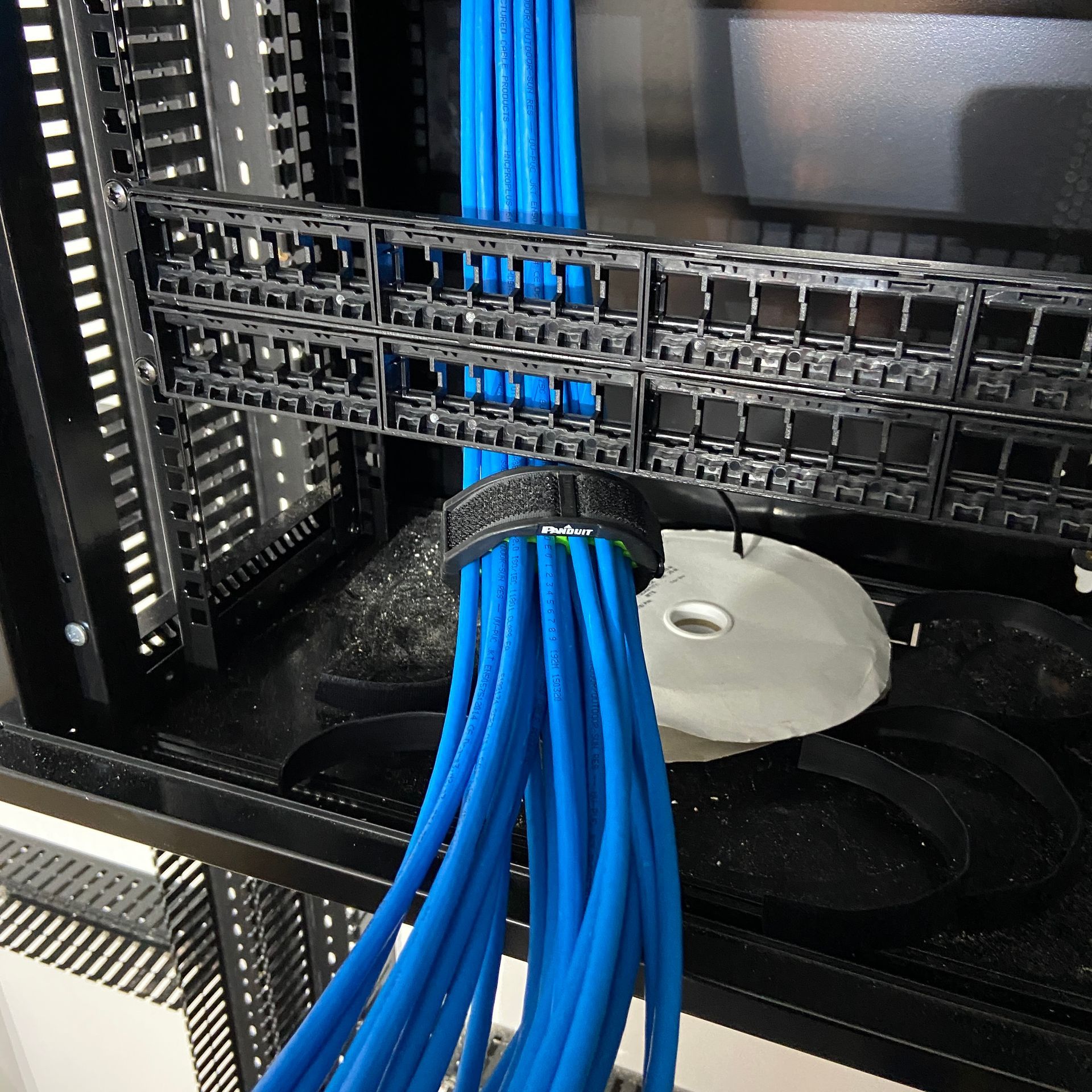 Photo of Cabling combing CAT6A data cables into patch panel