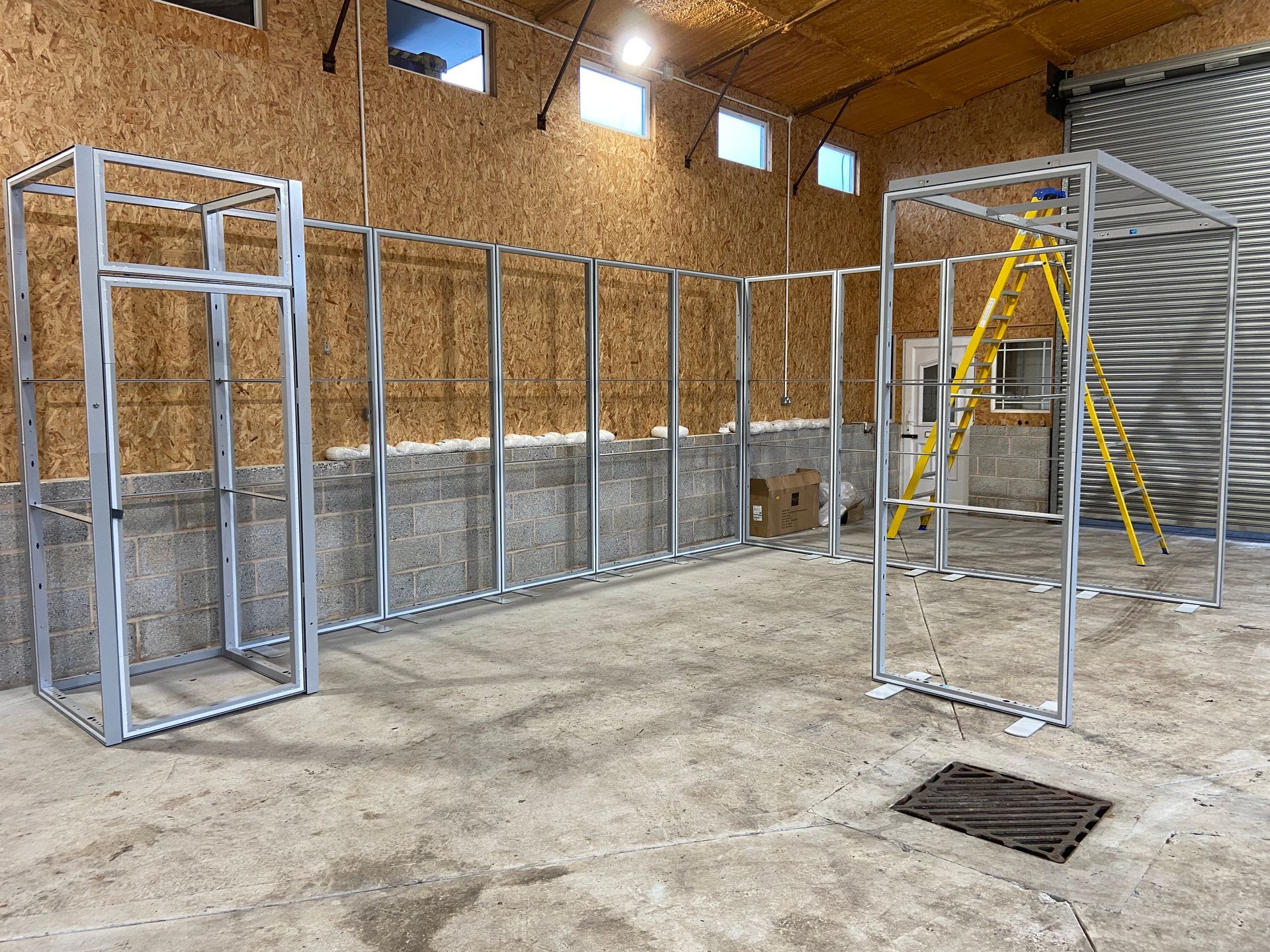 Photograph of prebuild of exhibition display system panels in workshop - Gillingham College