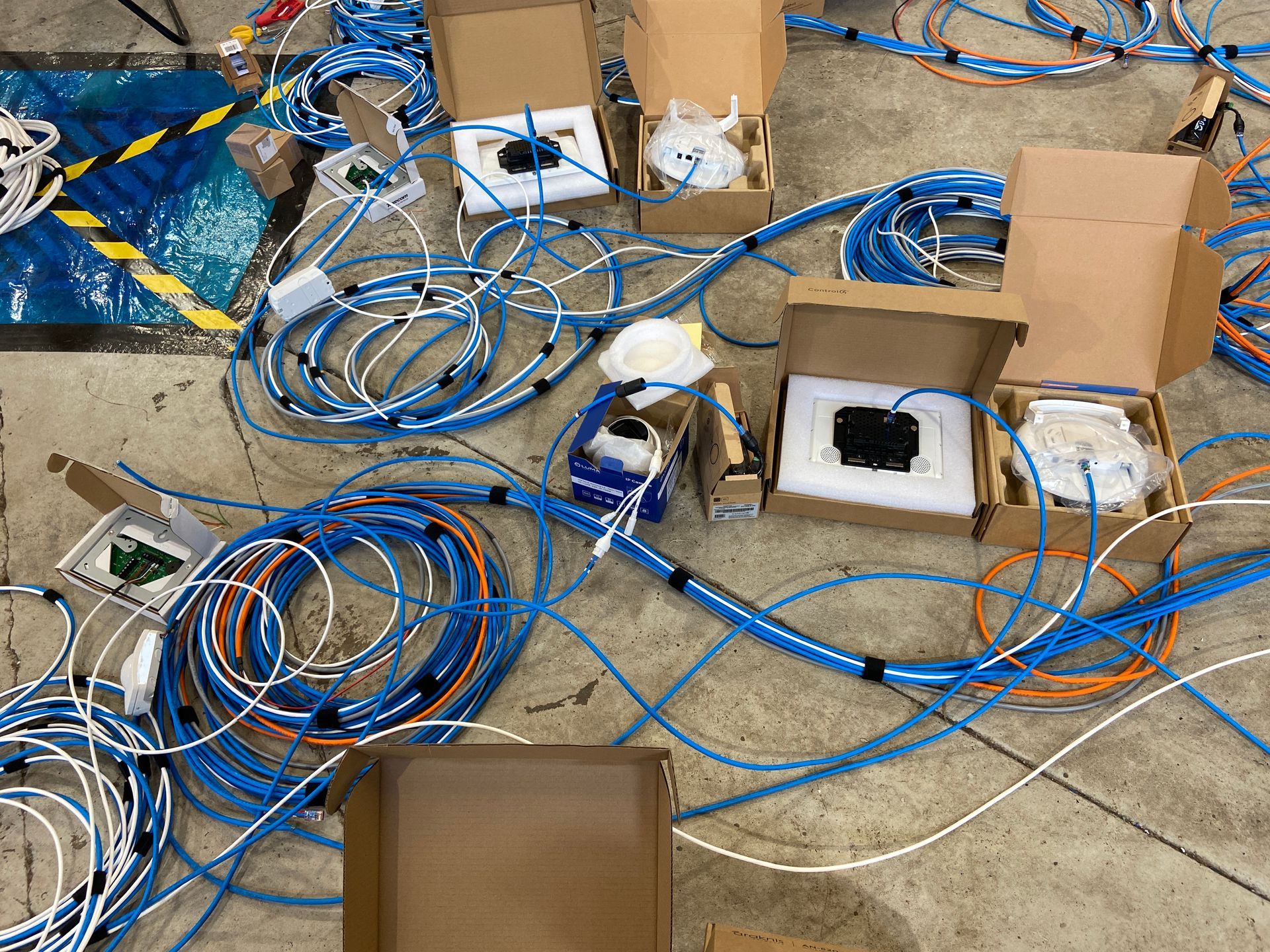 Photograph of equipment attached to wiring looms so that we can fully soak test equipment in workshop