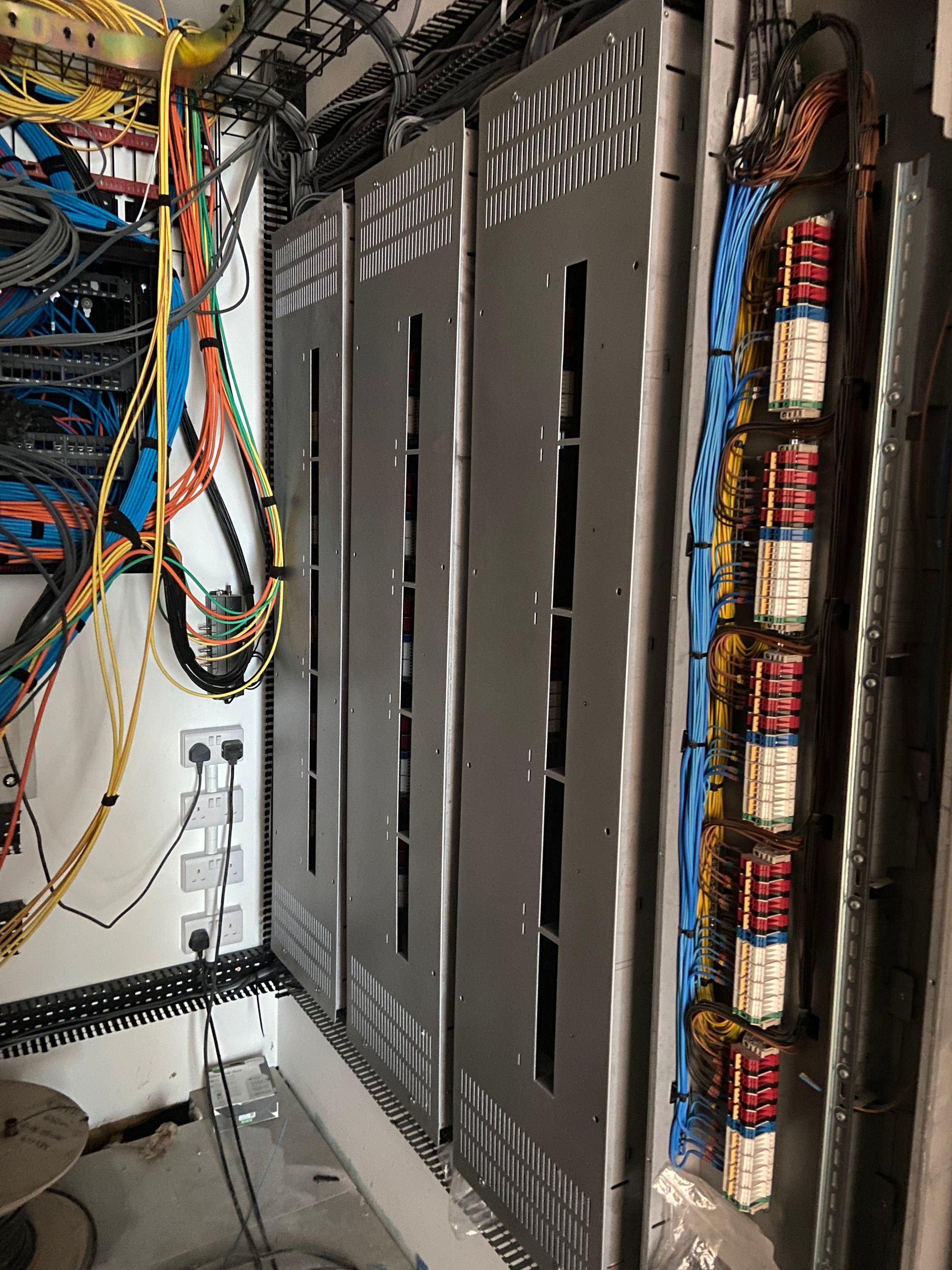 Photo of Light fixture cables terminated into Smart Lighting Panels by electrician