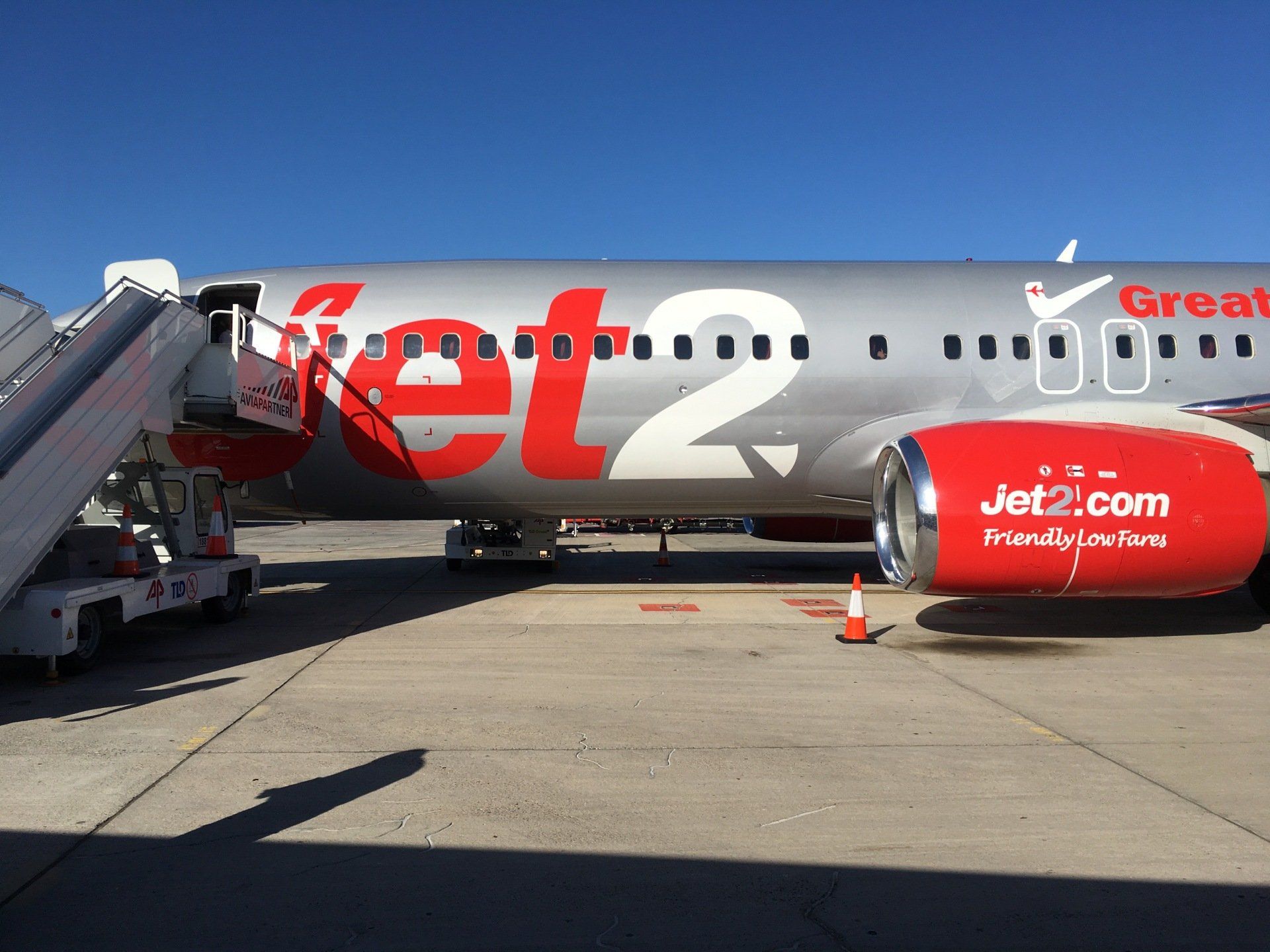 Photograph of side of Jet2.com airplane on tarmac prior to passengers boarding