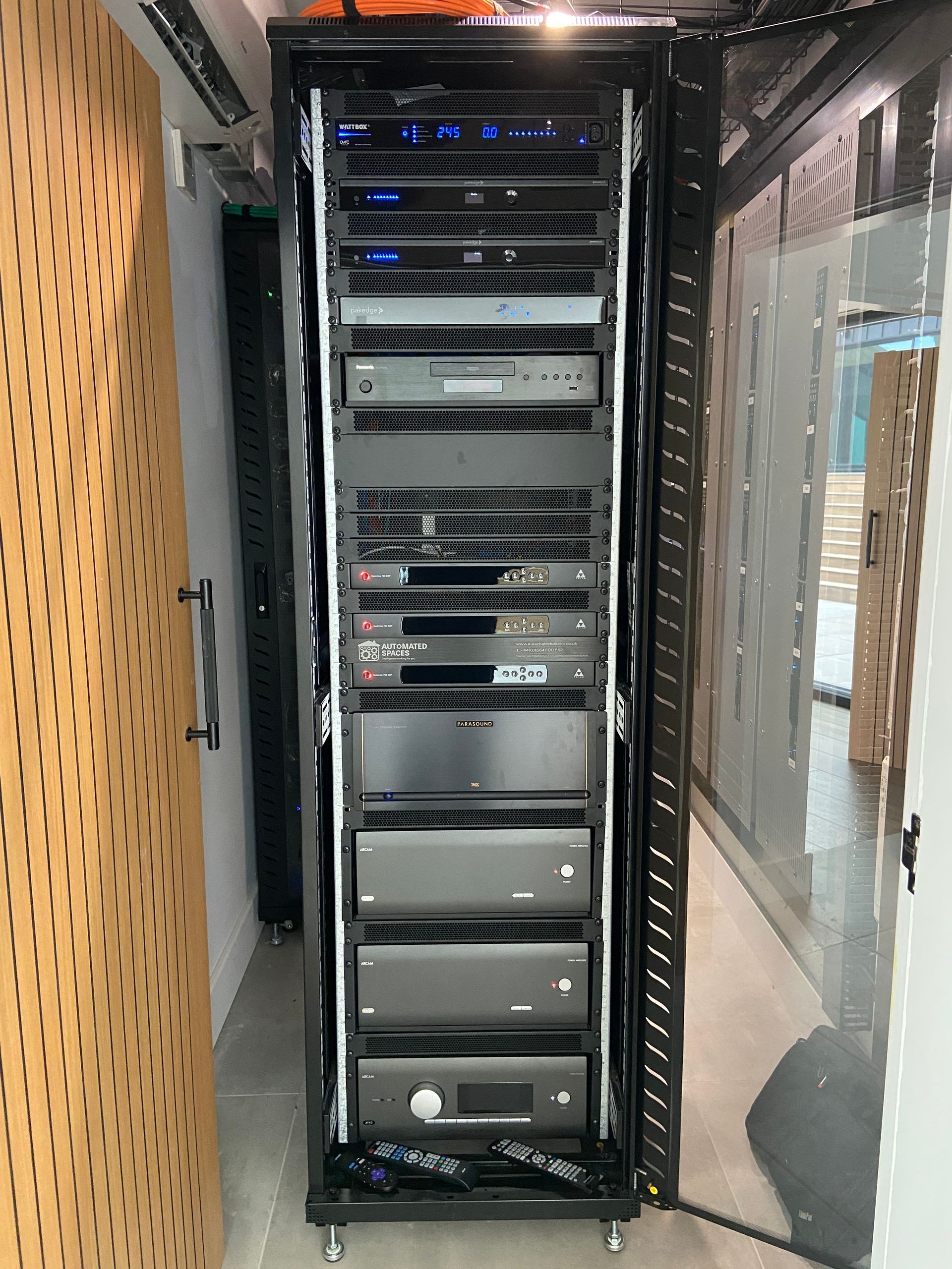 Photo Server rack that contains cinema equipment e.g., amplifiers, video processors, blu-ray player, PDUs and network switch