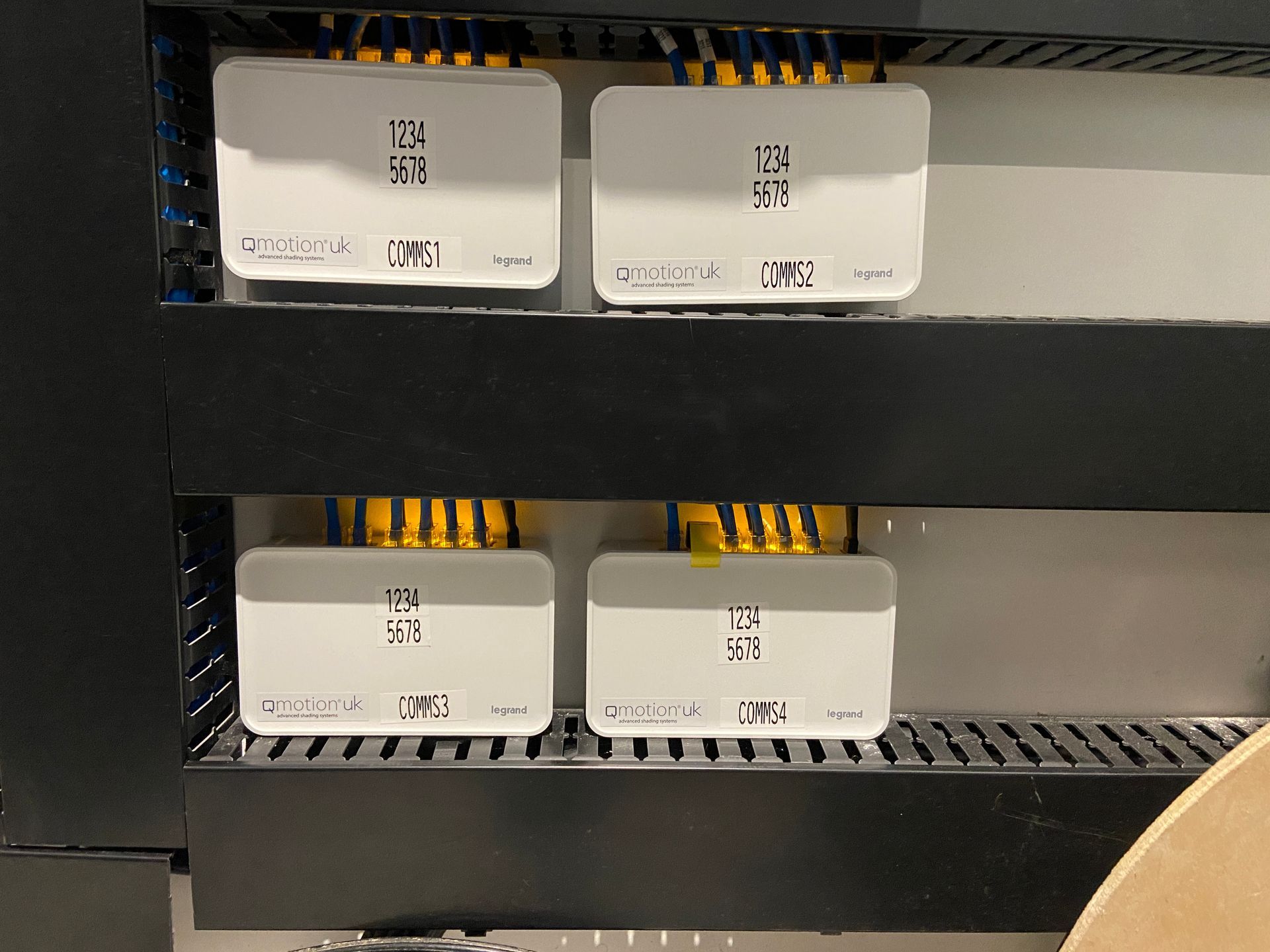 Photo of QMotion automated blinds communication modules to allow them to communicate and integrate with Control4