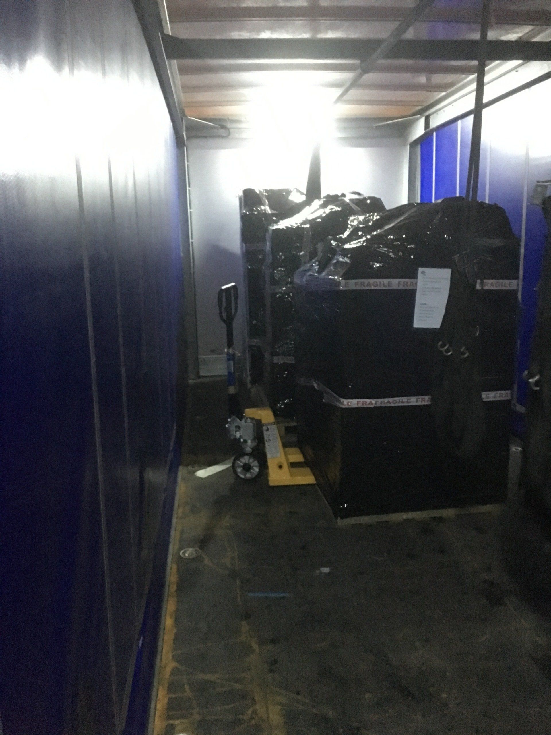 Photograph of collection of 3 pallets of equipment from Automated Spaces