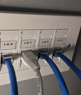Photograph of 4 RJ-45 Data sockets on a wall