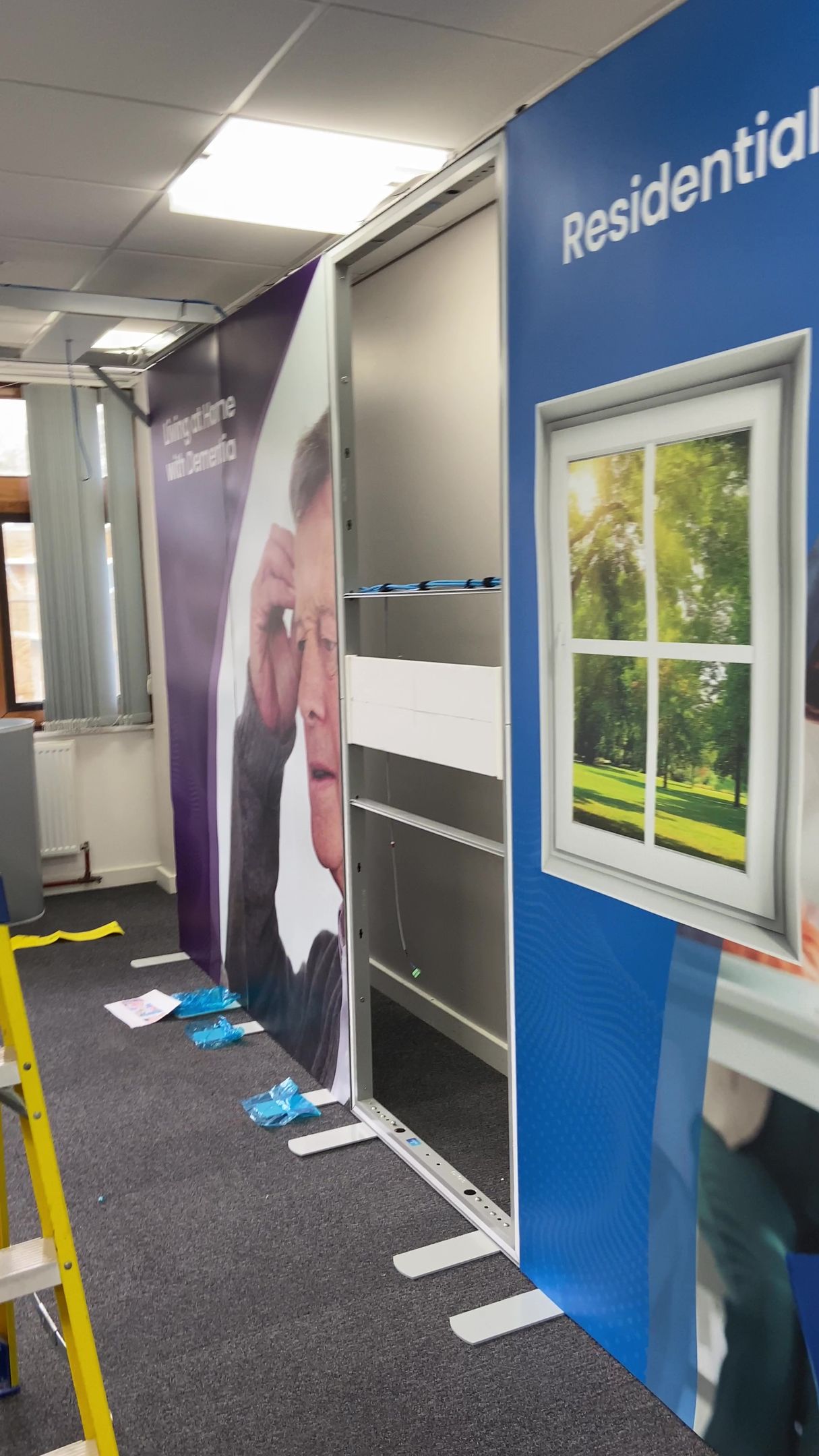 Photograph of vinyl printed graphics installed onto the exhibition space display system panels