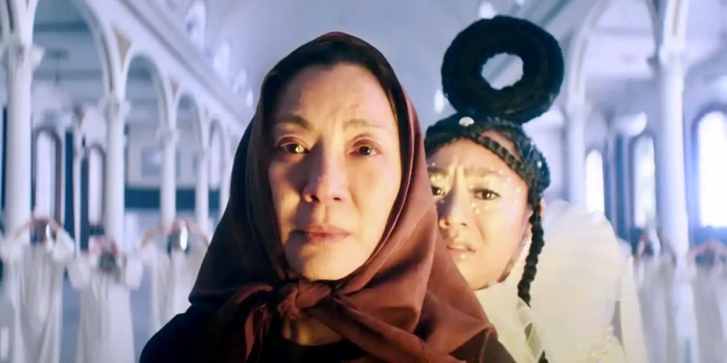 A movie poster for Everything Everywhere All at Once showing a woman in a scarf.