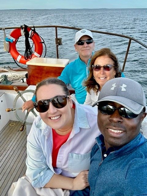 A group of people are posing for a picture on a boat
