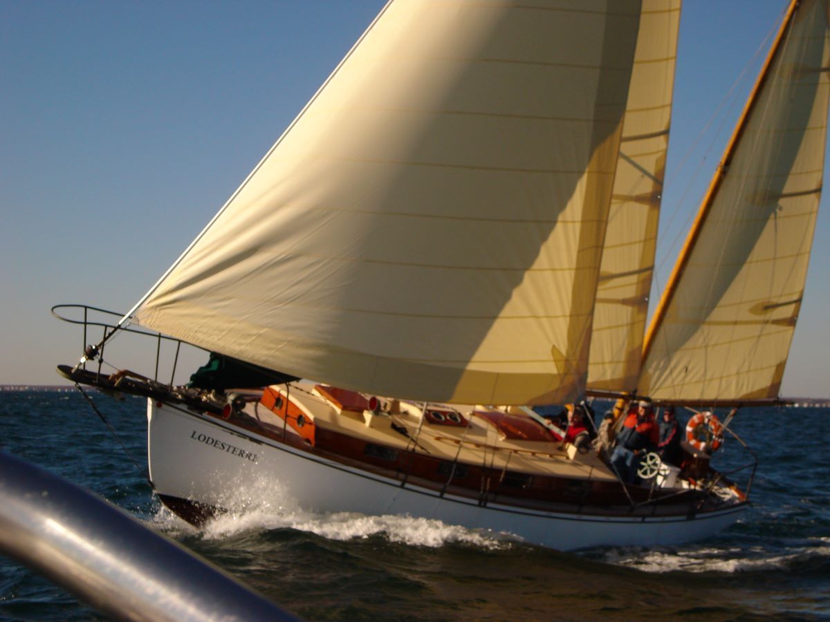 A sailboat is floating on a body of water