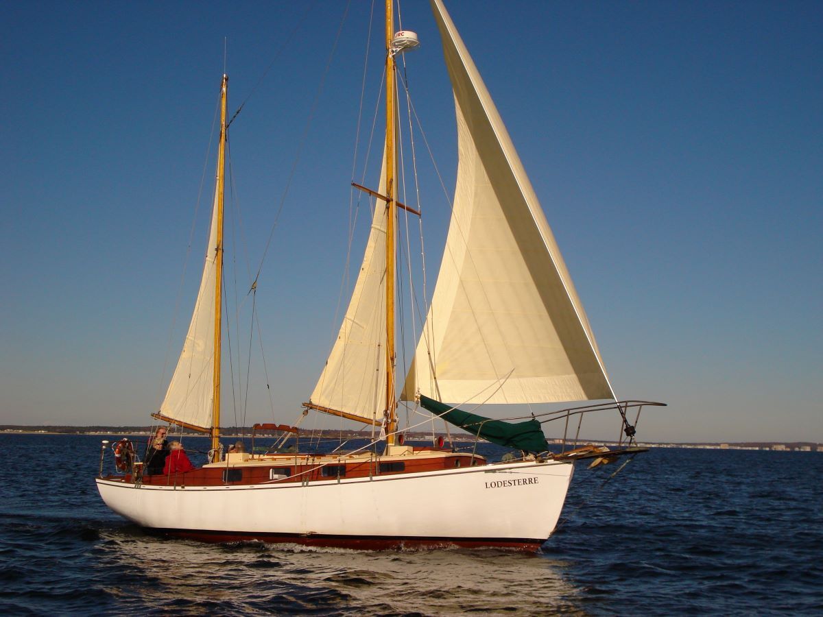 A sailboat with the name lewis on the side