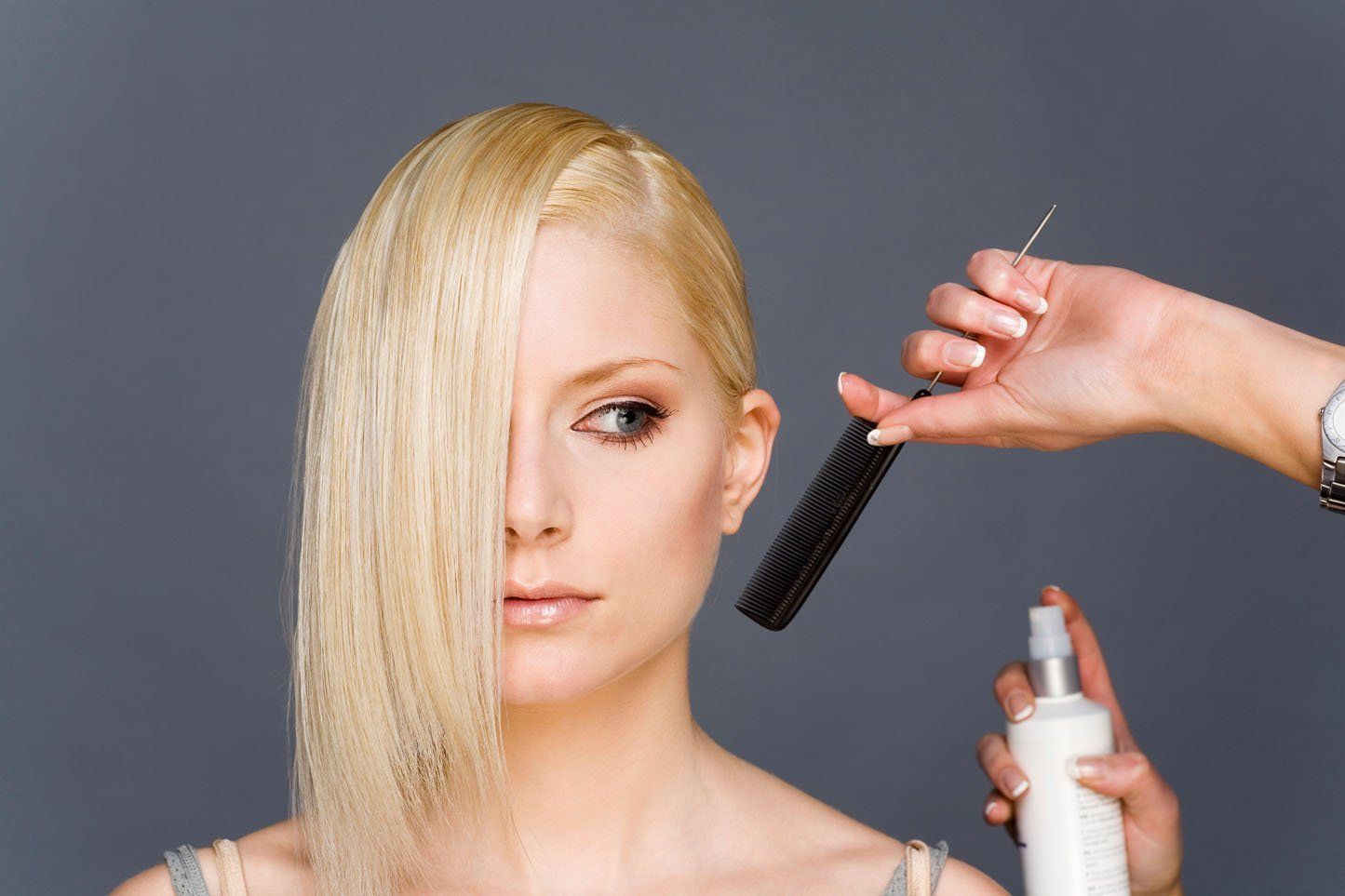 woman with blonde hair having her hair combed