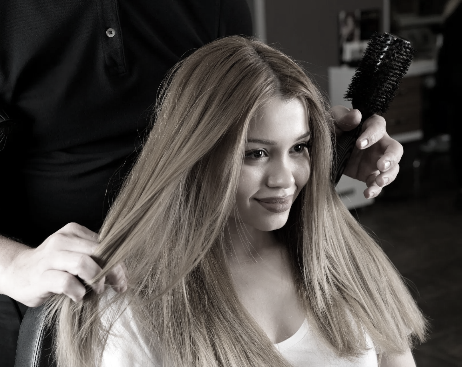 young happy woman with long hair in salon