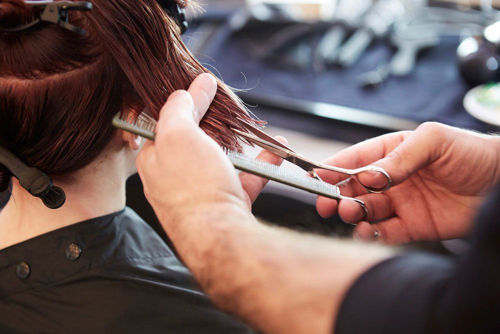 Woman getting her hair cut