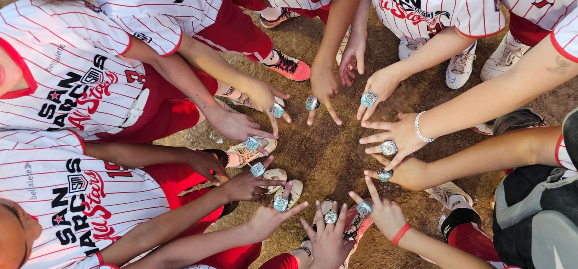 Baseball on a dark surface, with visible stitching.