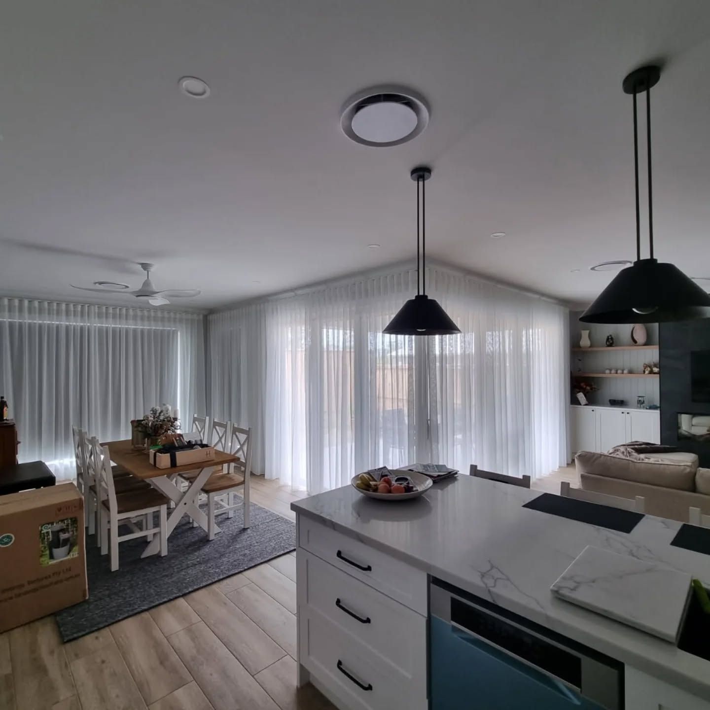 A kitchen with a table and chairs in it