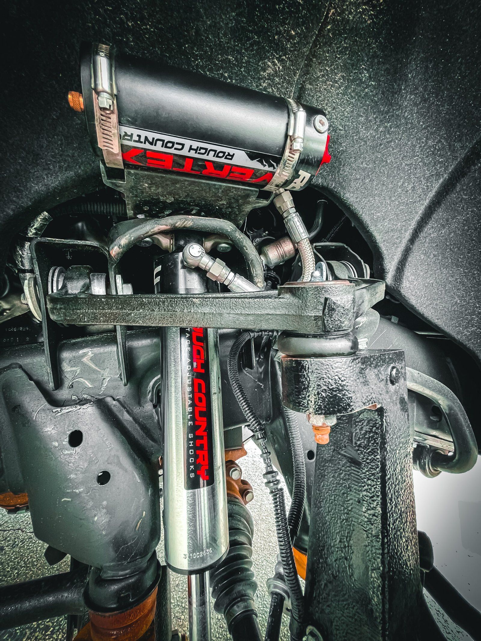 A close up of a shock absorber on a car. | CB Wheels & Tires, 4x4, Suspension, Center