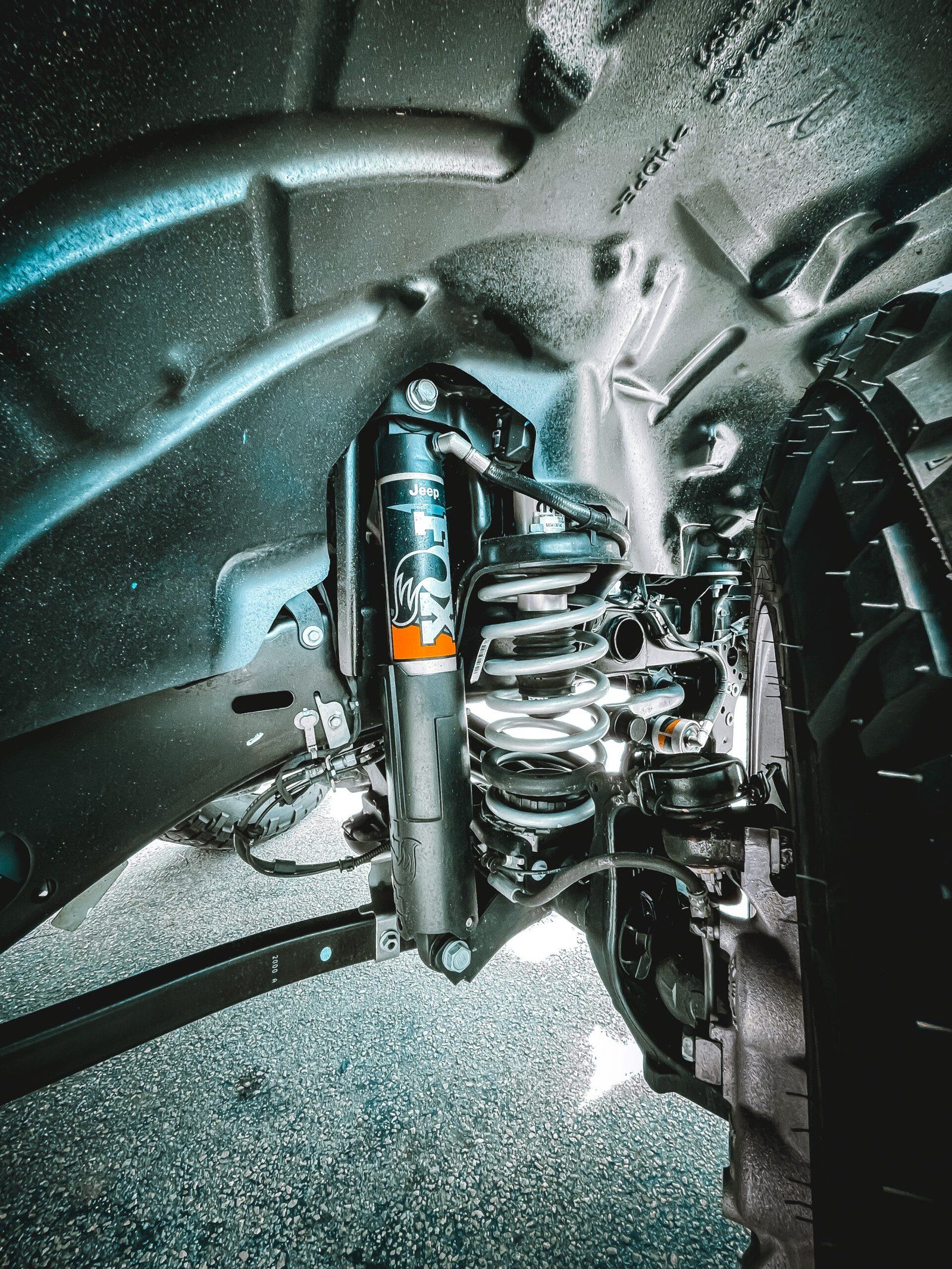 A close up of a shock absorber on a car. | CB Wheels & Tires, 4x4, Suspension, Center