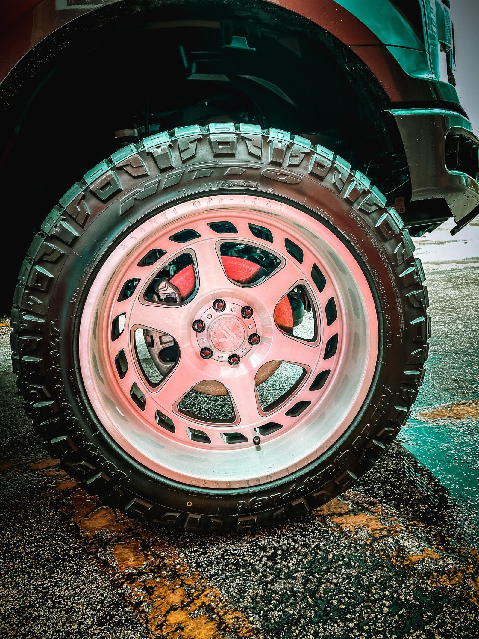 A close up of a pink wheel on a car. | CB Wheels & Tires, 4x4, Suspension, Center