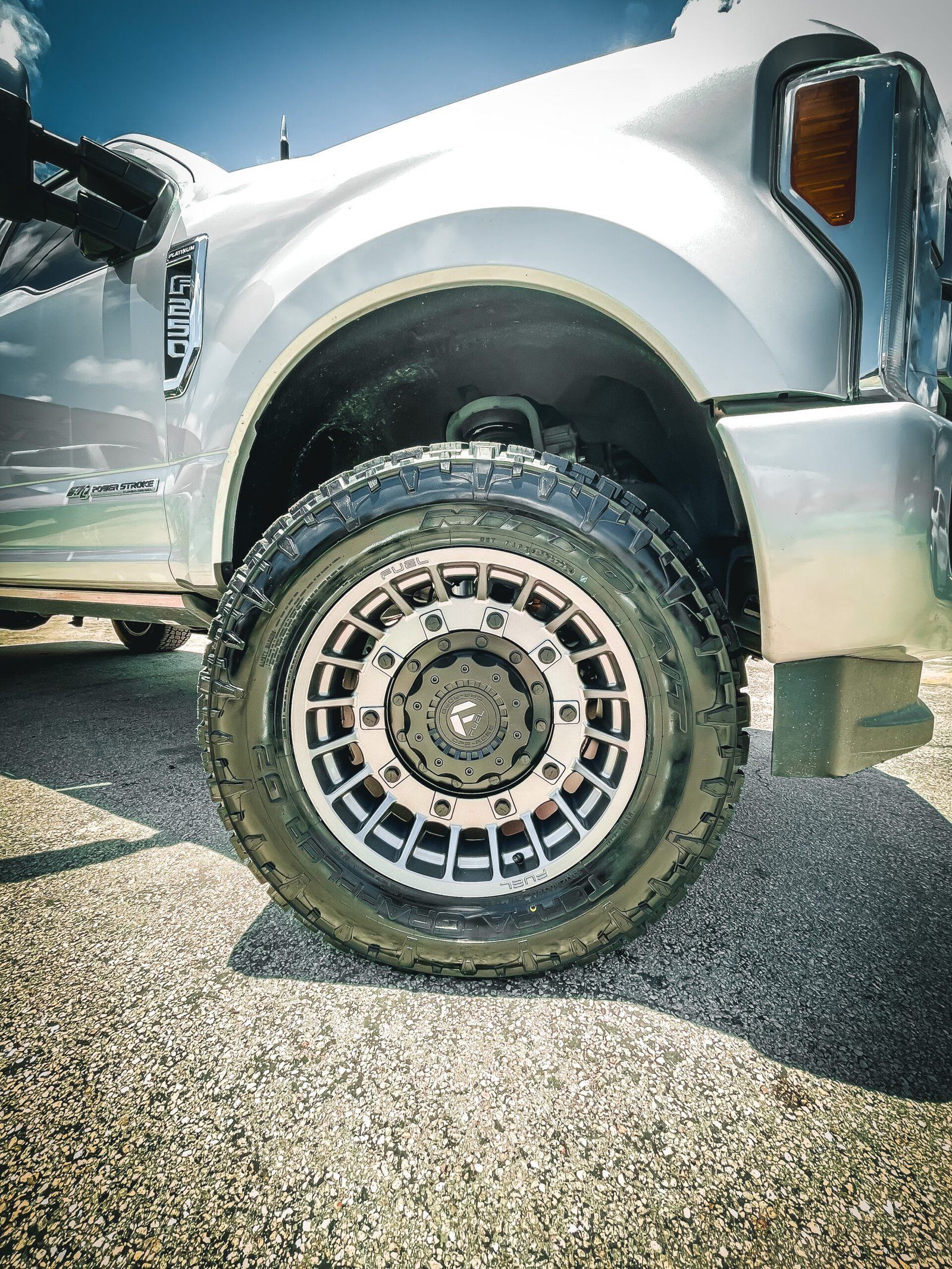 A close up of a truck wheel on a gravel road. | CB Wheels & Tires, 4x4, Suspension, Center