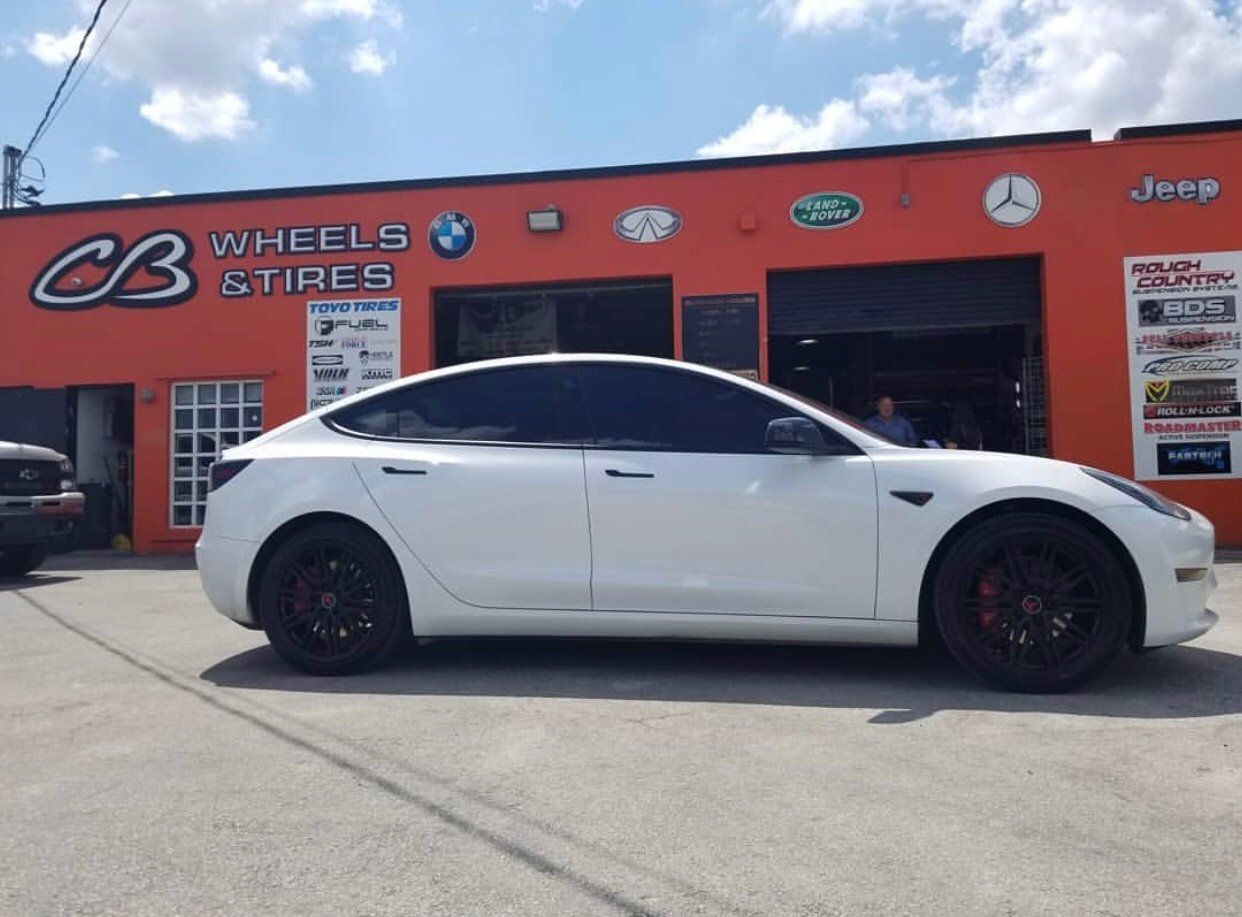A white car is parked in front of cb wheels and tires | CB Wheels & Tires, 4x4, Suspension, Center