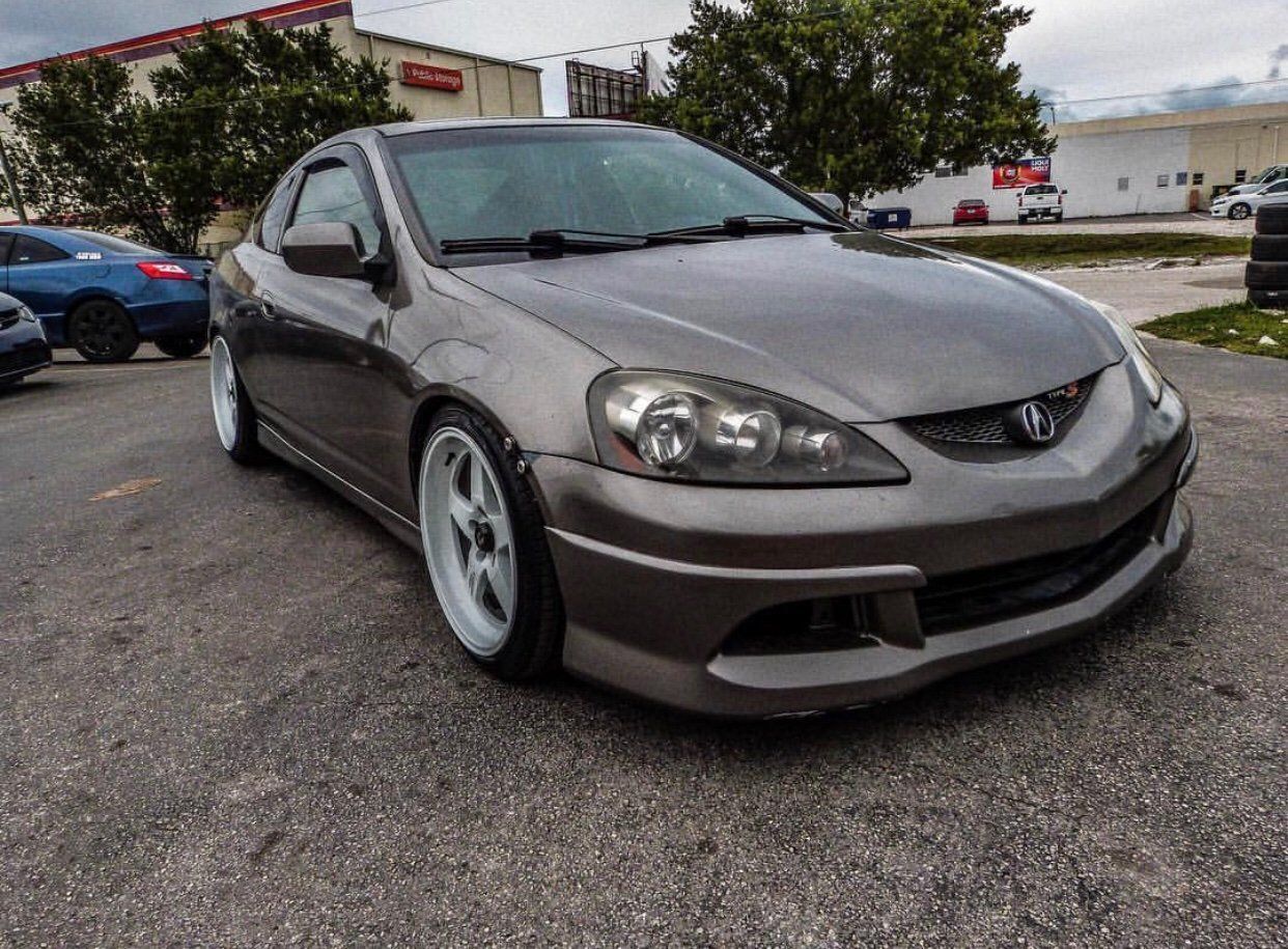 A gray acura integra is parked in a parking lot. | CB Wheels & Tires, 4x4, Suspension, Center