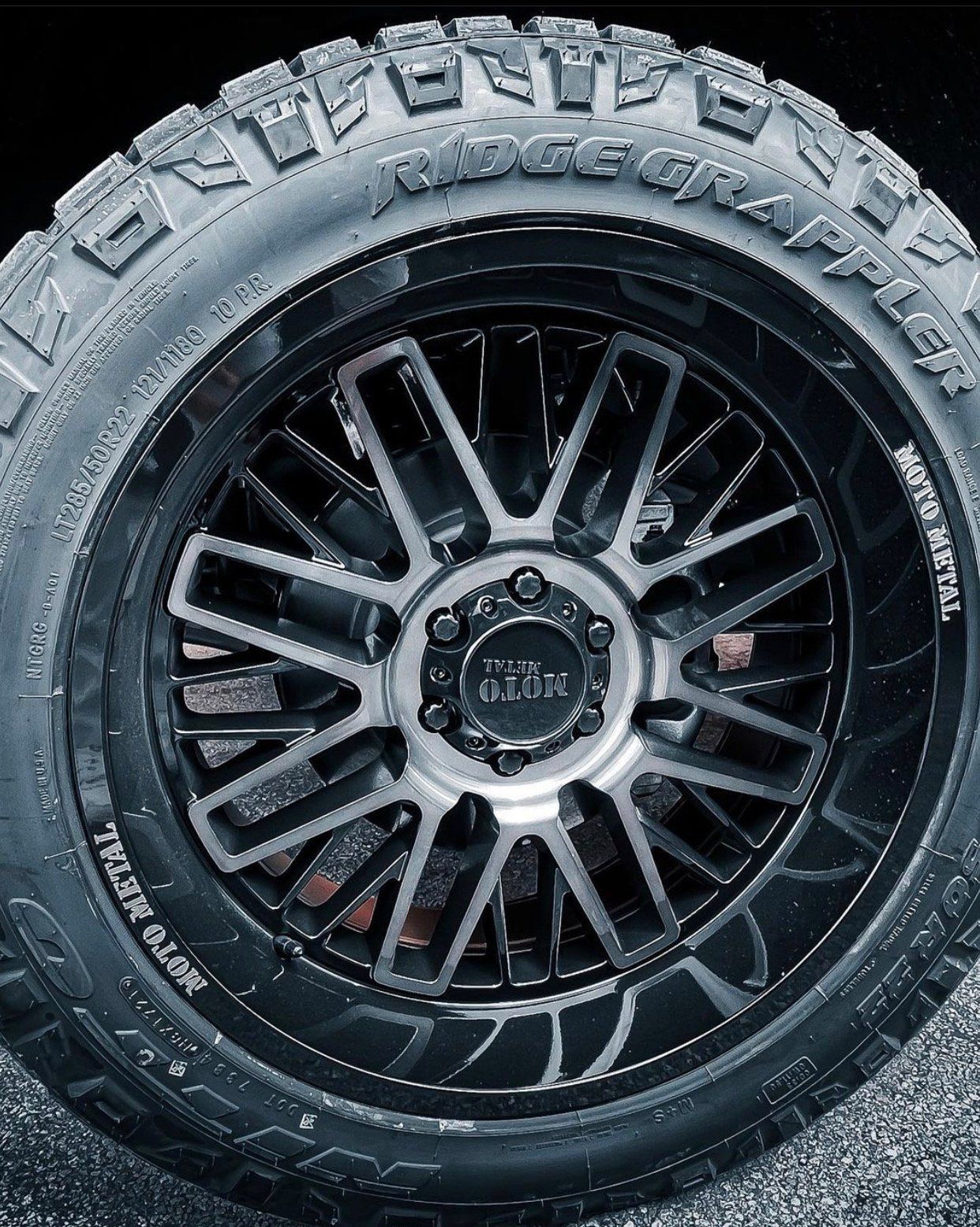 A close up of a black tire on a black rim. | CB Wheels & Tires, 4x4, Suspension, Center