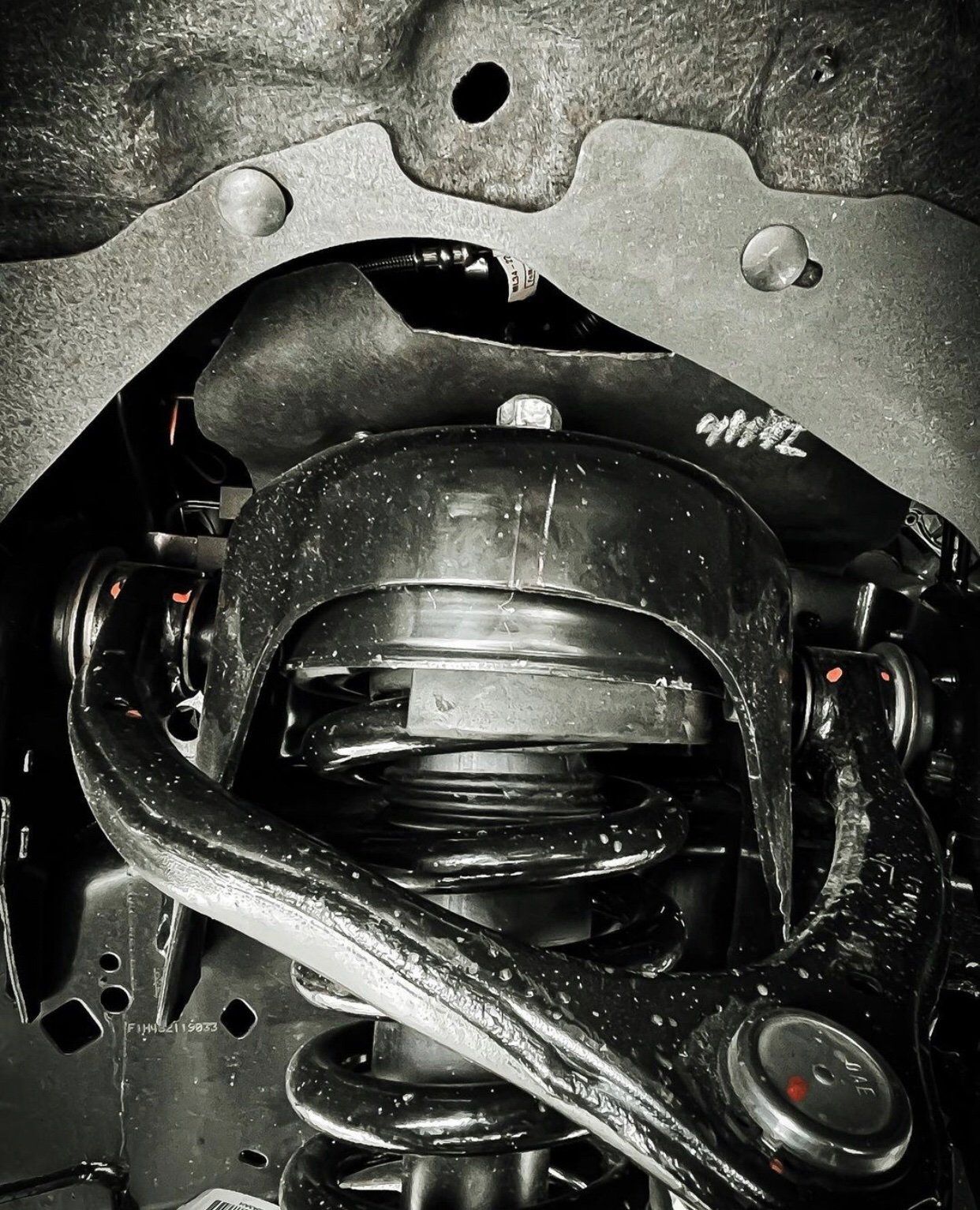 A black and white photo of the underside of a car | CB Wheels & Tires, 4x4, Suspension, Center