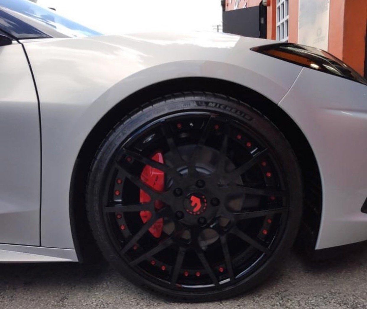 A silver car with black wheels and red brake calipers | CB Wheels & Tires, 4x4, Suspension, Center