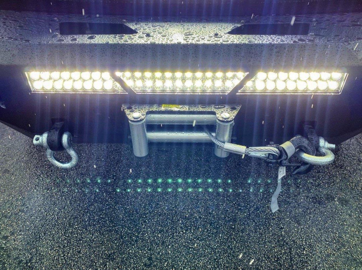 A close up of a winch on the back of a truck. | CB Wheels & Tires, 4x4, Suspension, Center