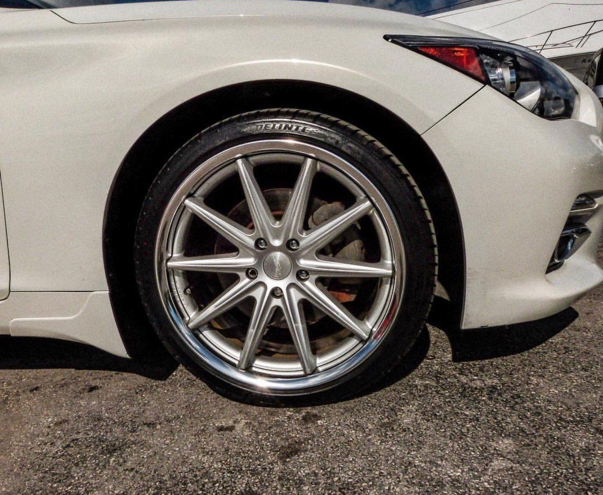 A close up of a white car 's wheel and tire | CB Wheels & Tires, 4x4, Suspension, Center