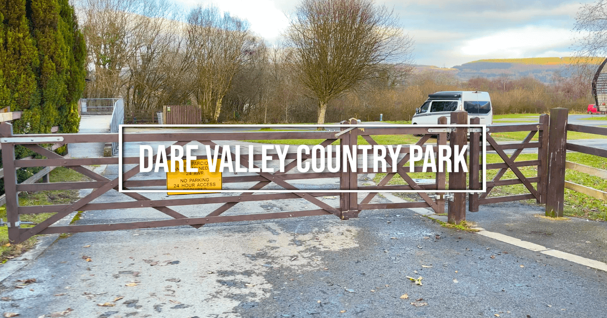 A wooden gate with the words dare valley country park written on it.