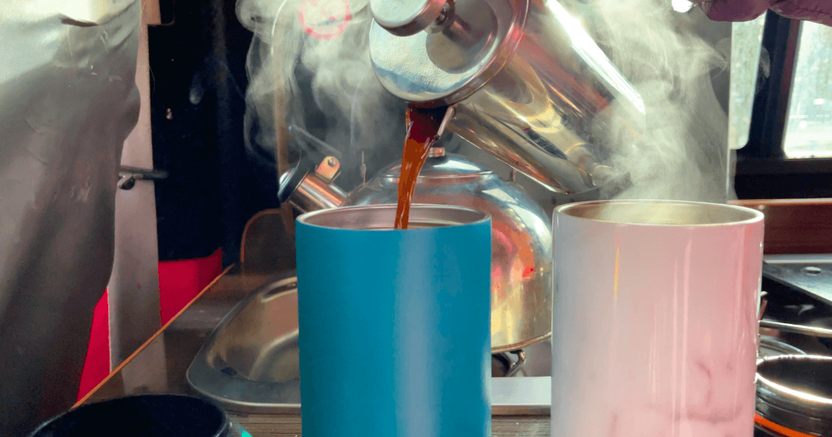 Pouring coffee into a blue cup