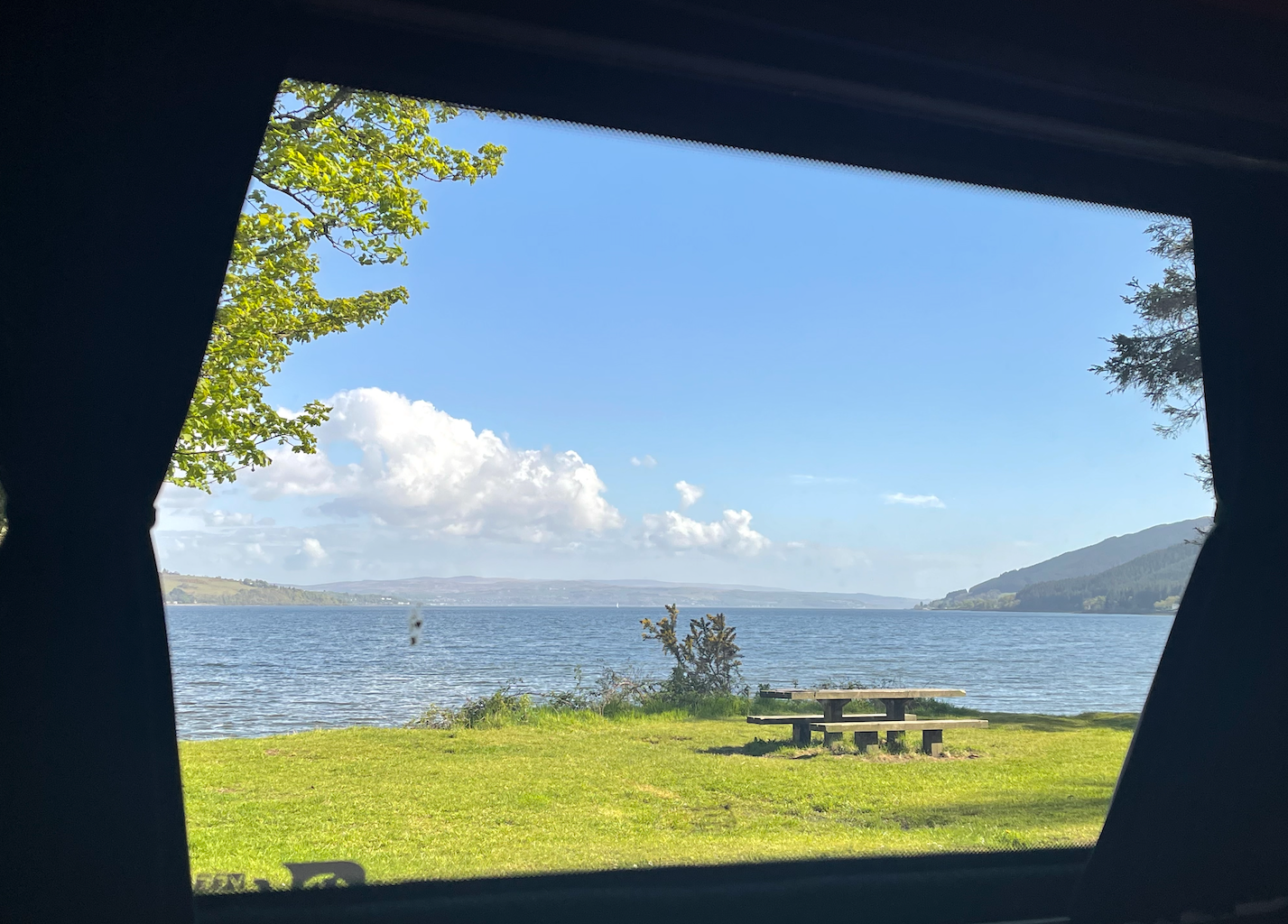 A view of a lake from a car window