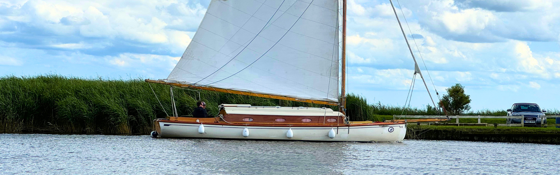 A sailboat is floating on top of a body of water.