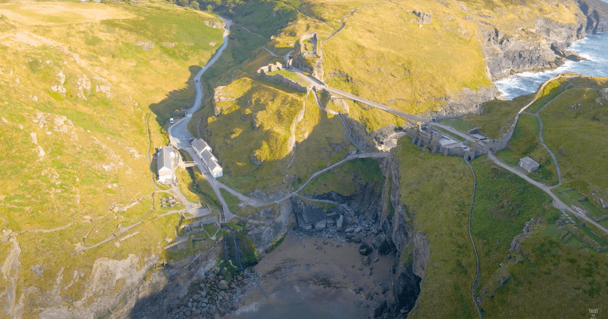 an aerial view of a Tintagel Castle and  bridge