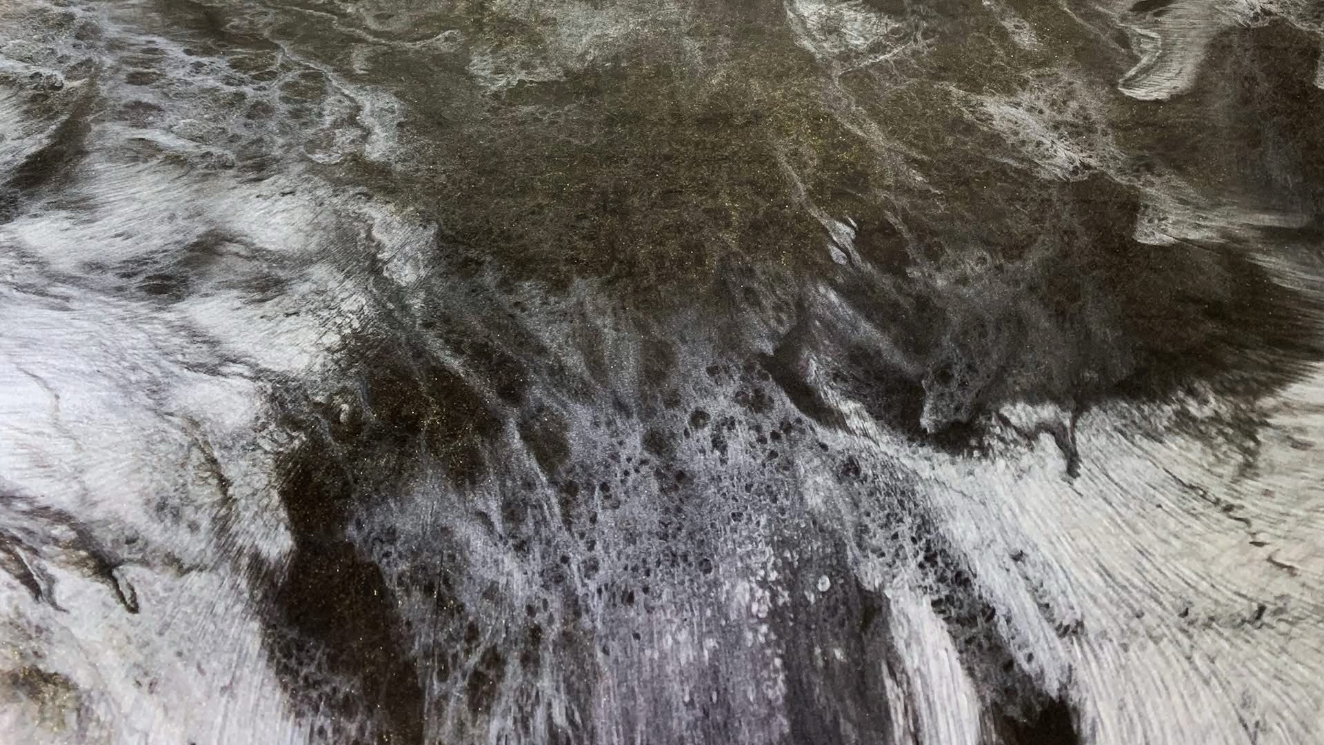 It is a black and white photo of a waterfall.