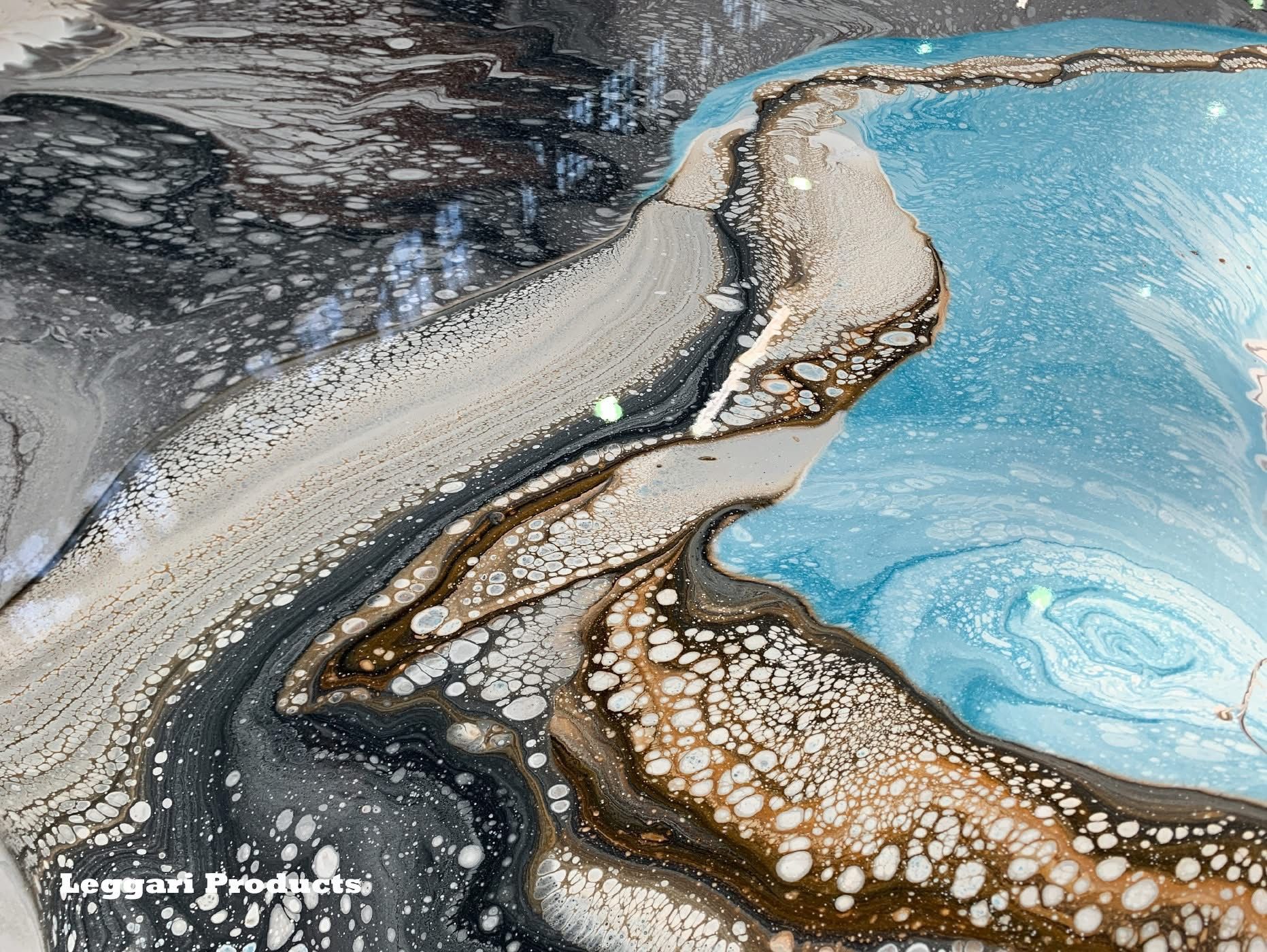 A close up of a painting of a river with a swirl in the middle.