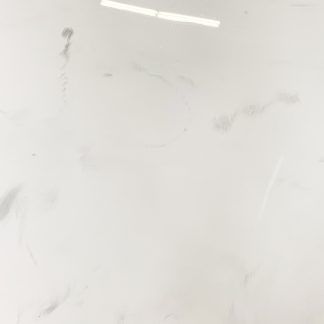 A close up of a white tile with a marble texture.