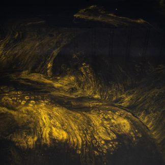 A close up of a yellow painting on a black background.