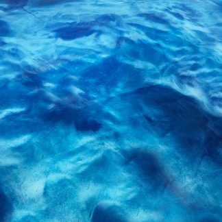 A close up of a blue water surface in a pool.