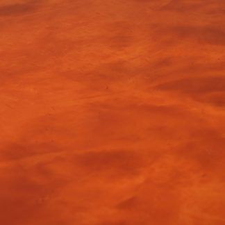 A close up of a red leather texture.