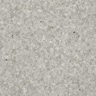 A close up of a white granite counter top.