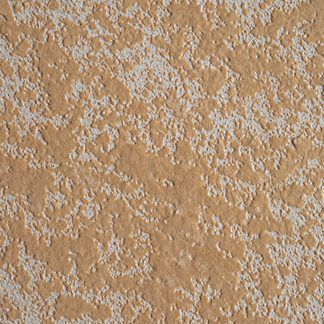 A close up of a brown and white wall with a texture.