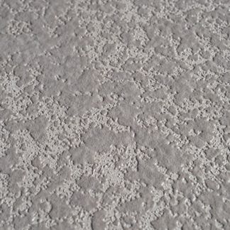 A close up of a gray wall with a texture.