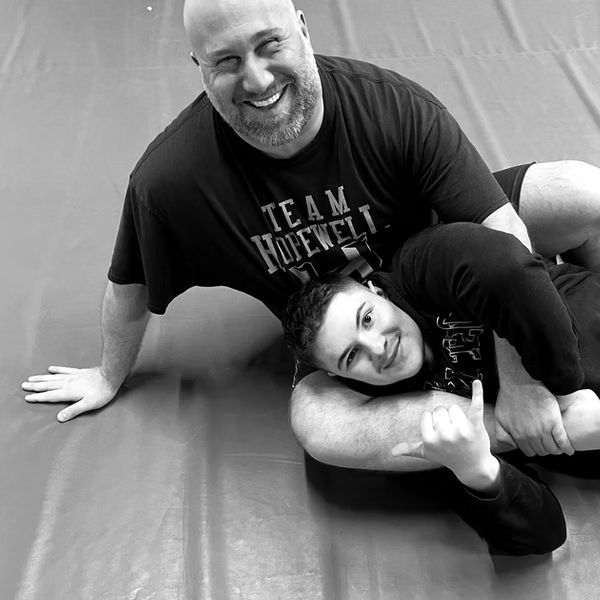 two men practicing a jiu jitsu grappling hold