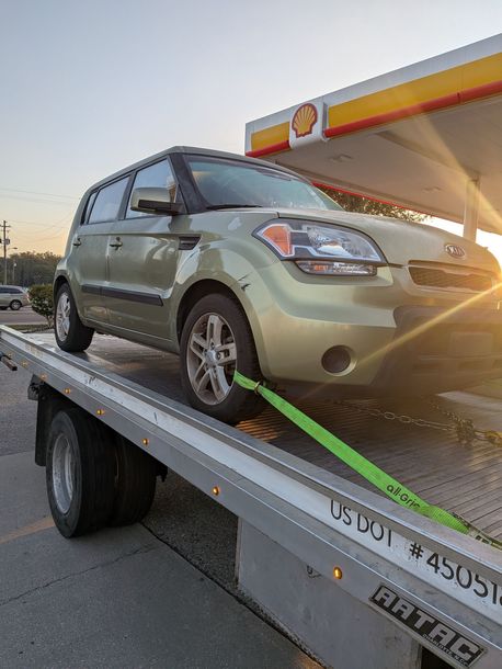 Small suv on tow truck