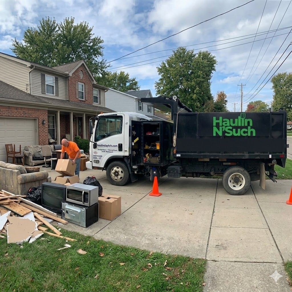 Haulin-N-Such truck removing junk from a Massillon, Ohio driveway